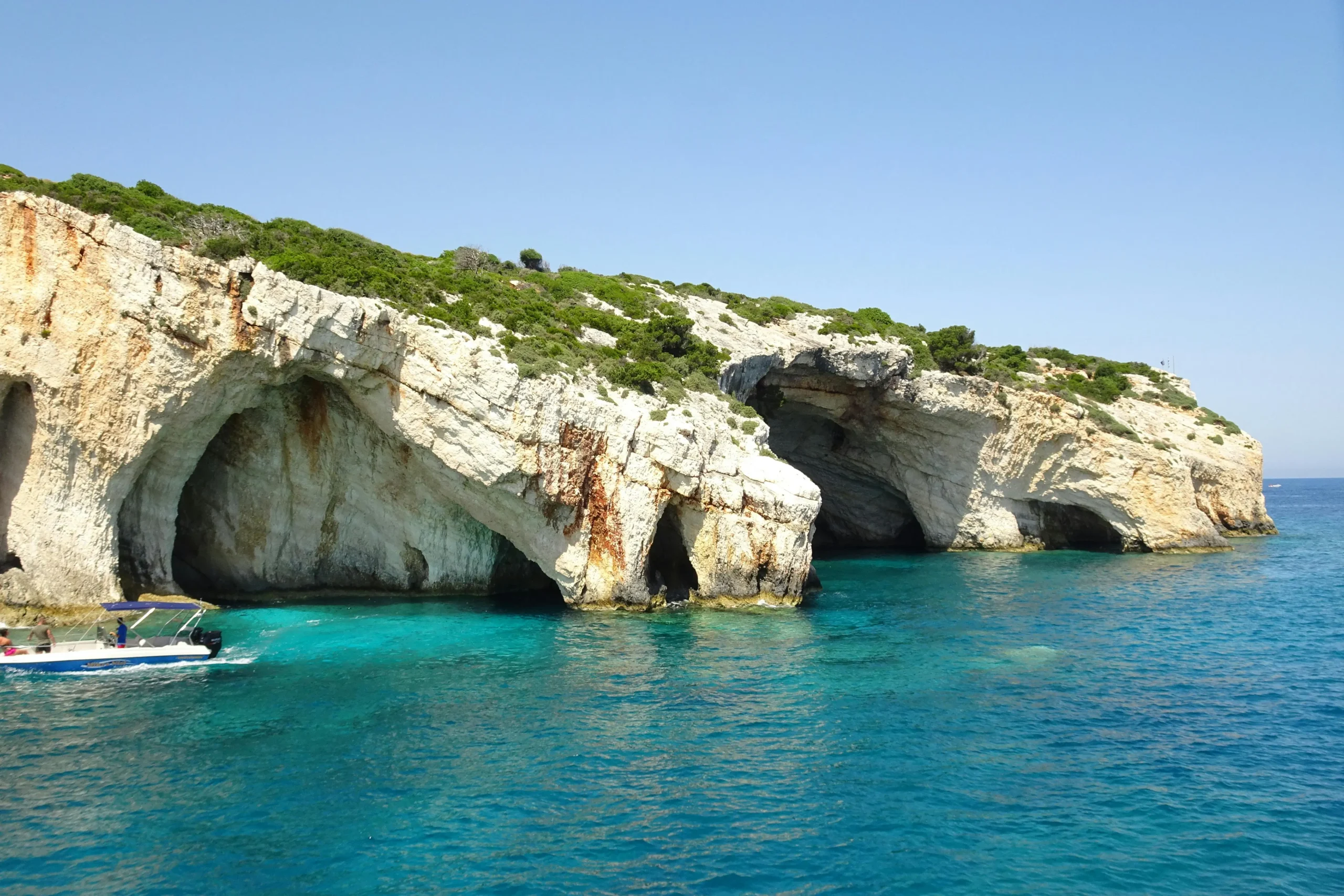 Blue Caves Zakynthos turquoise Ionian Sea and motorboat